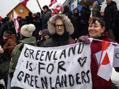 Greenland Protesters Use Bold Caps to Respond to Trump’s MAGA Message